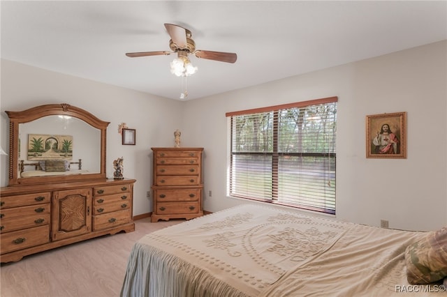 bedroom featuring a ceiling fan and light wood finished floors