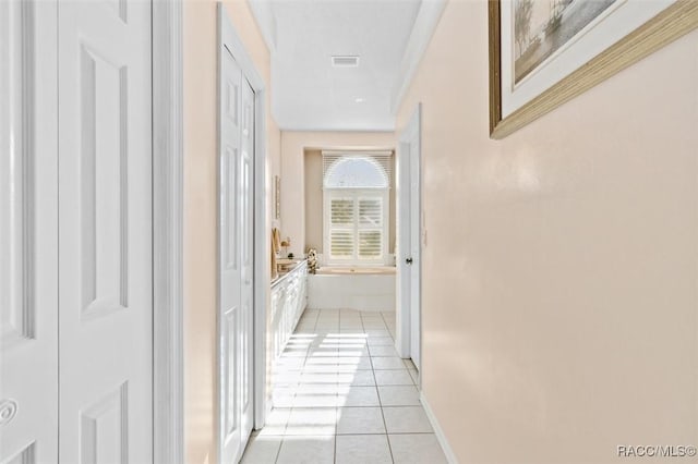 hallway with light tile patterned floors