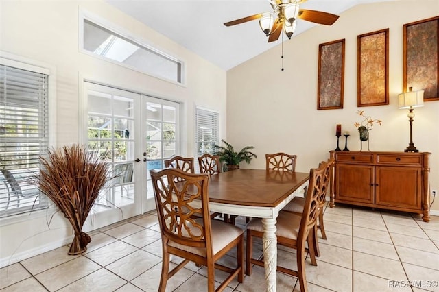 dining space featuring light tile patterned floors, vaulted ceiling, french doors, and ceiling fan