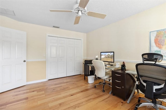 office space with ceiling fan and light wood-type flooring