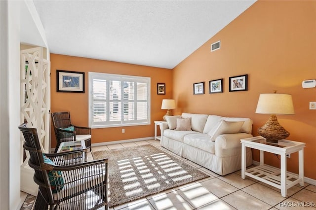 tiled living room with vaulted ceiling