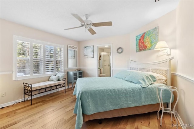 bedroom featuring ensuite bath and light hardwood / wood-style floors