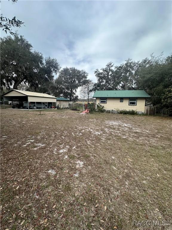 view of yard featuring a carport