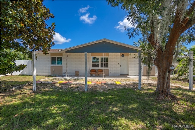 ranch-style home with a front lawn