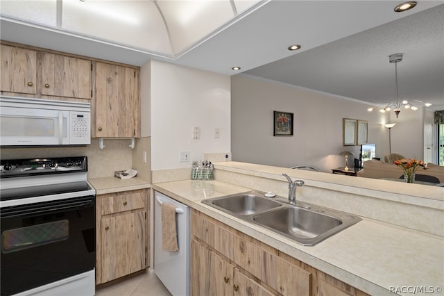 kitchen with pendant lighting, white appliances, crown molding, sink, and light tile patterned floors