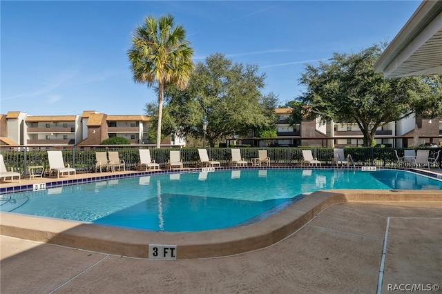 view of swimming pool with a patio area