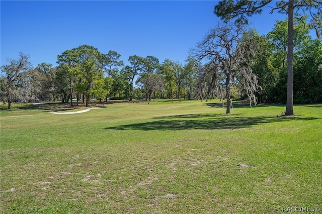 surrounding community with a lawn