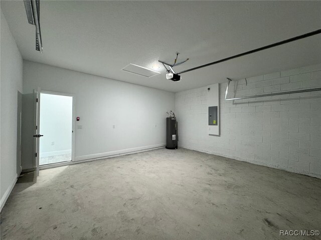 7549 N Santos Dr, Citrus Springs, FL 34434 - garage featuring electric panel, water heater, a garage door opener, and concrete block wall