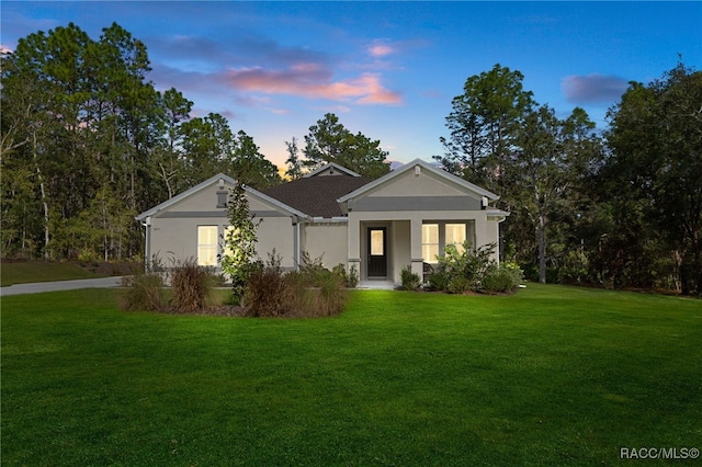 view of front of house with a lawn