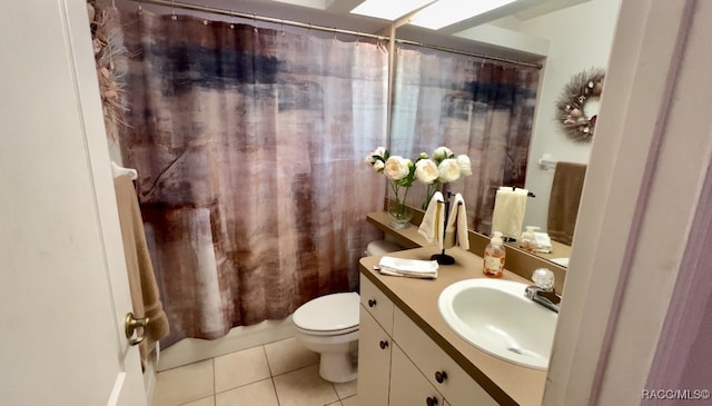 bathroom featuring tile patterned floors, vanity, and toilet