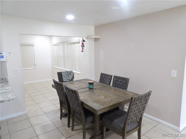 dining area featuring light tile patterned floors