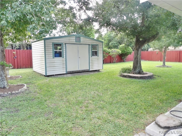 view of outbuilding with a lawn