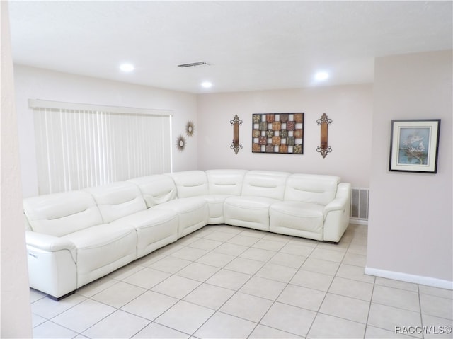 unfurnished living room featuring light tile patterned flooring