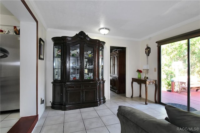 interior space with crown molding and light tile patterned flooring