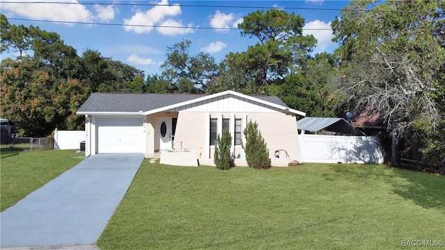 view of front facade featuring a front yard and a garage