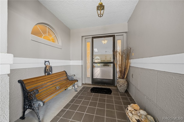 entrance foyer with a textured ceiling