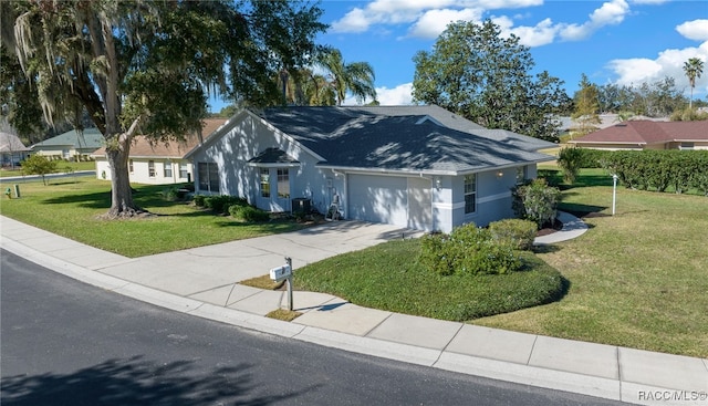 single story home featuring a garage and a front yard