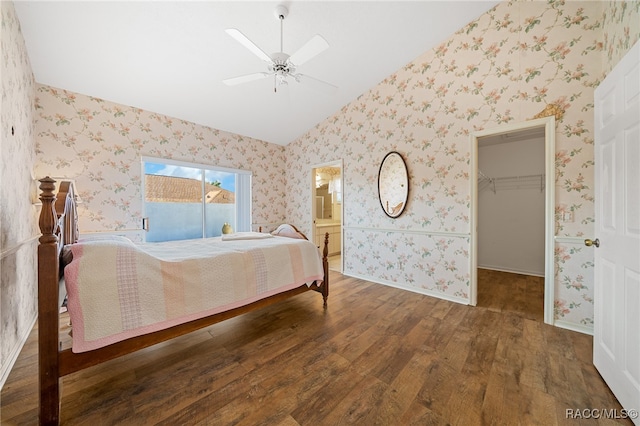 bedroom featuring ensuite bath, ceiling fan, wood-type flooring, a spacious closet, and a closet