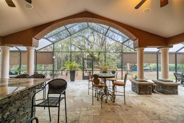 view of patio / terrace featuring a lanai and outdoor dry bar