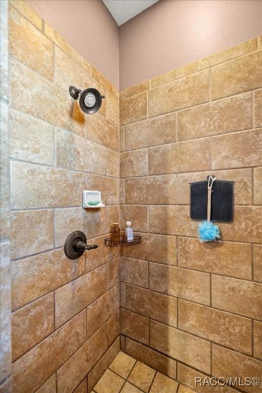 full bathroom with a tile shower