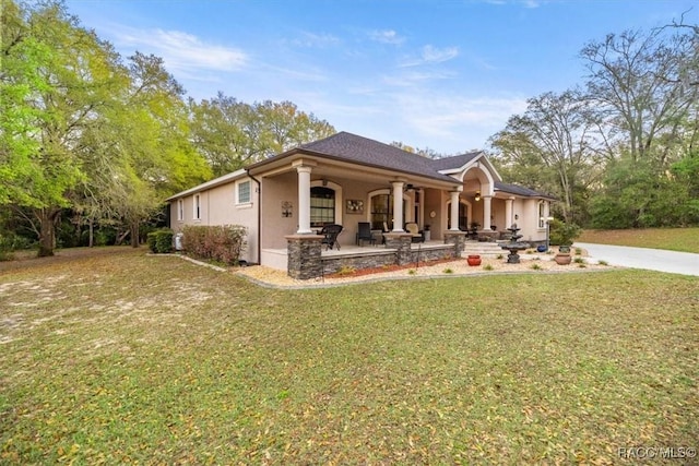 view of home's exterior featuring stucco siding and a yard