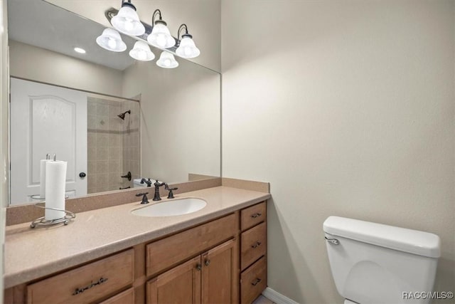 bathroom featuring vanity, toilet, a chandelier, and walk in shower