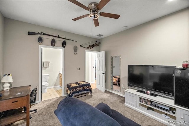 tiled living room with a ceiling fan, visible vents, carpet floors, and baseboards