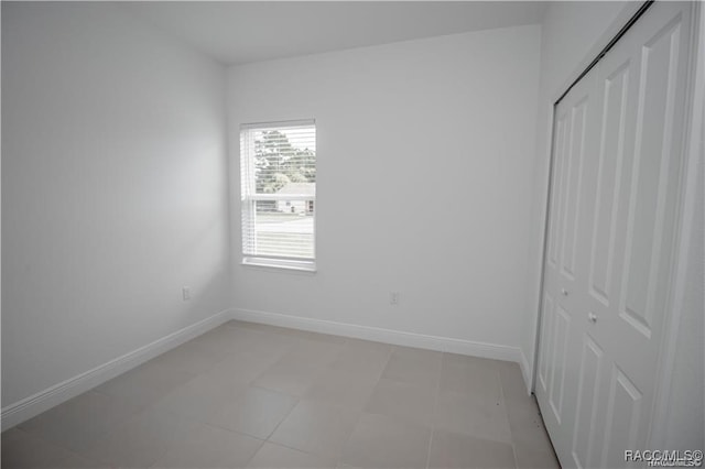 unfurnished bedroom featuring a closet