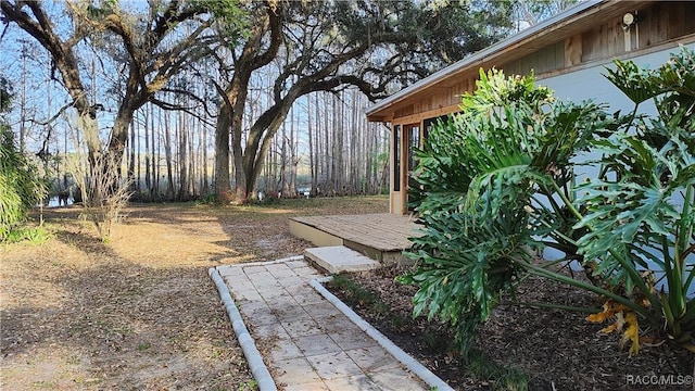 view of yard with a wooden deck