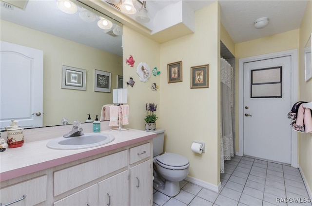 full bath featuring baseboards, vanity, toilet, and tile patterned floors