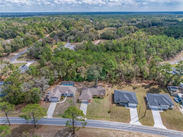 aerial view with a wooded view