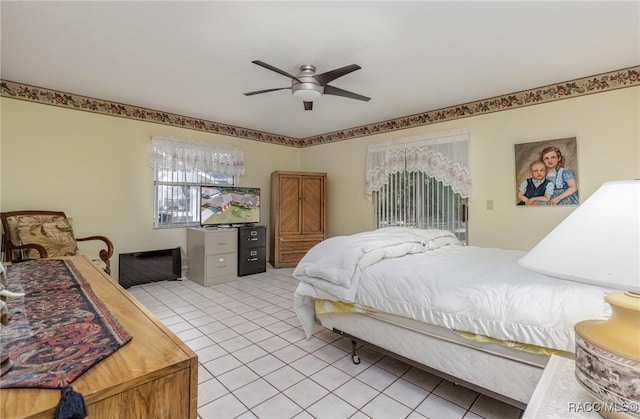 bedroom featuring ceiling fan and light tile patterned floors