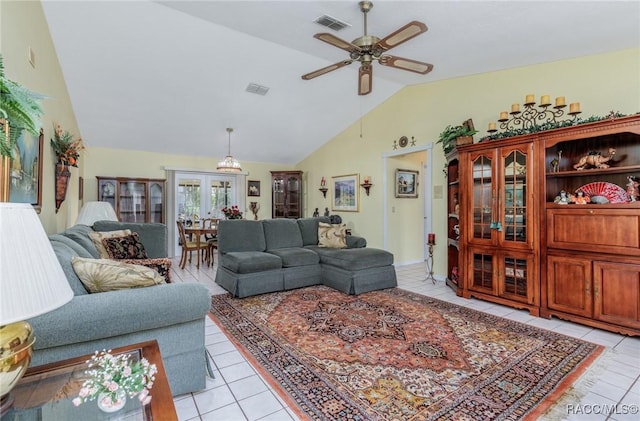 living room featuring vaulted ceiling, ceiling fan, light tile patterned flooring, and visible vents