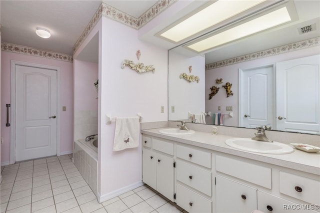 full bath with tile patterned flooring, visible vents, a sink, and double vanity