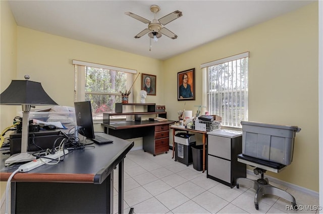 home office featuring light tile patterned floors and a ceiling fan