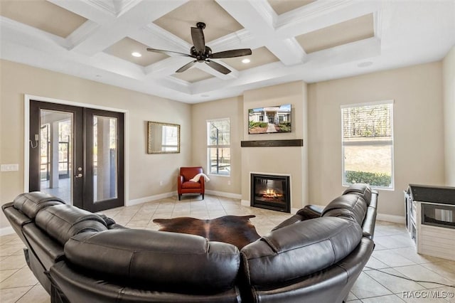 tiled living room with french doors, coffered ceiling, and beam ceiling