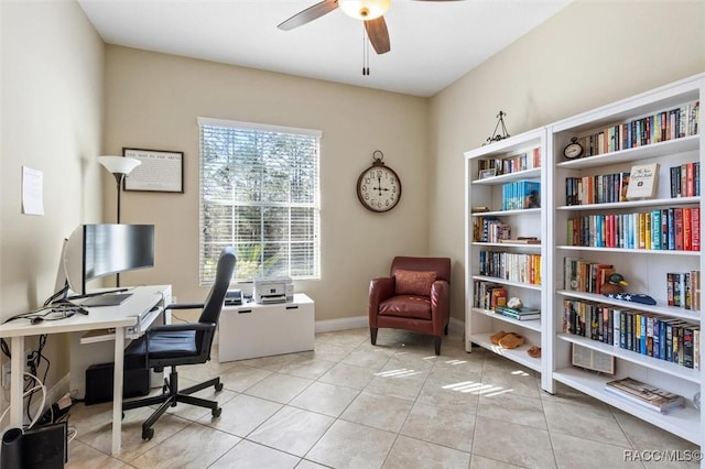 tiled office space featuring ceiling fan