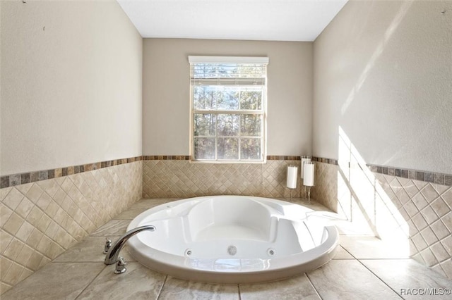 bathroom featuring a relaxing tiled tub