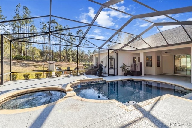 view of pool with a lanai, a patio area, ceiling fan, and an in ground hot tub