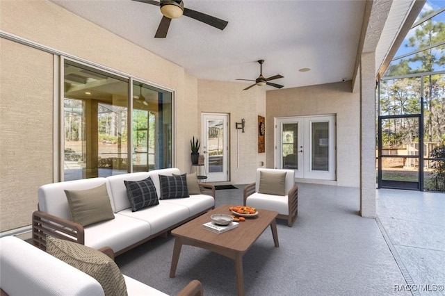 view of patio / terrace featuring ceiling fan, an outdoor hangout area, and a lanai