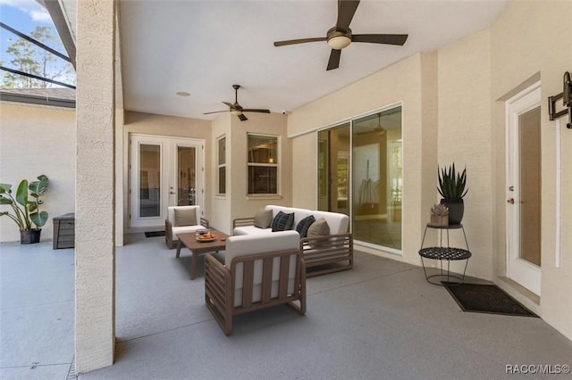 view of patio featuring a lanai, outdoor lounge area, ceiling fan, and french doors