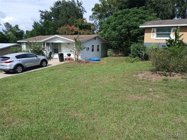 view of front of home with a front lawn