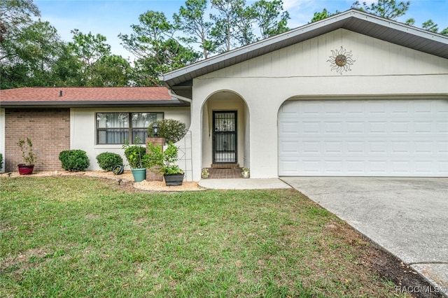 ranch-style house with driveway, brick siding, a garage, and a front yard