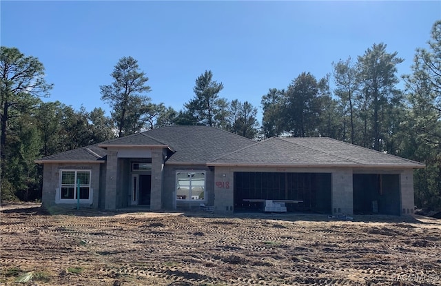 view of front of property featuring a garage