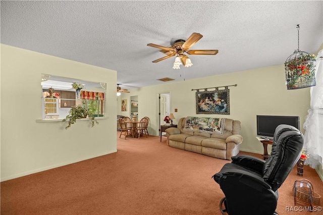 9708 W Hawthorne St, Crystal River, FL 34428 - carpeted living room with baseboards, ceiling fan, and a textured ceiling