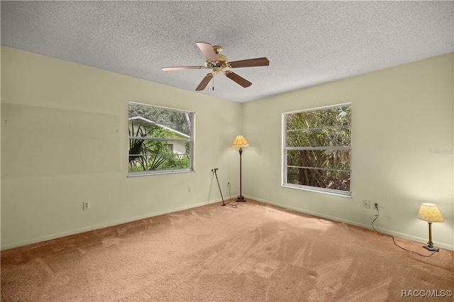 9708 W Hawthorne St, Crystal River, FL 34428 - carpeted spare room featuring a textured ceiling, baseboards, and ceiling fan
