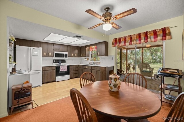 9708 W Hawthorne St, Crystal River, FL 34428 - dining room with ceiling fan, visible vents, and light colored carpet