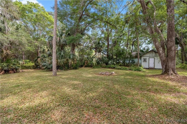 9708 W Hawthorne St, Crystal River, FL 34428 - view of yard with a storage shed and an outbuilding
