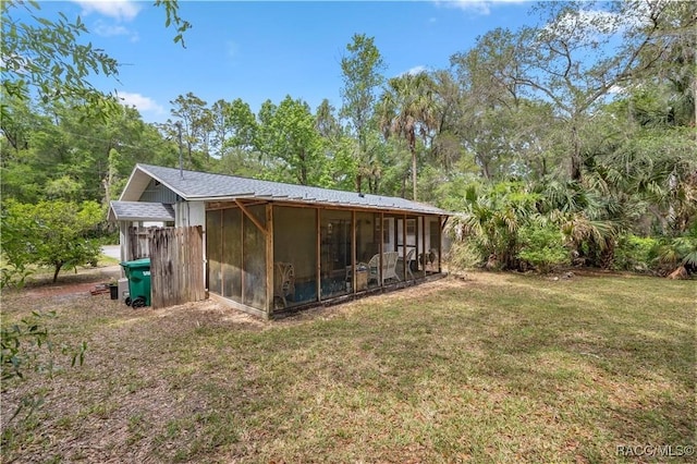 9708 W Hawthorne St, Crystal River, FL 34428 - back of property with a sunroom and a lawn