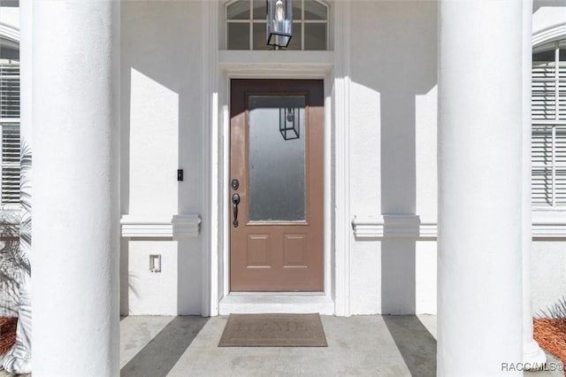 12 Colubrina Ct, Homosassa, FL 34446 - doorway to property with stucco siding